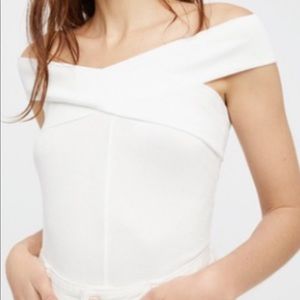 Free People white top with crossing straps. Size L